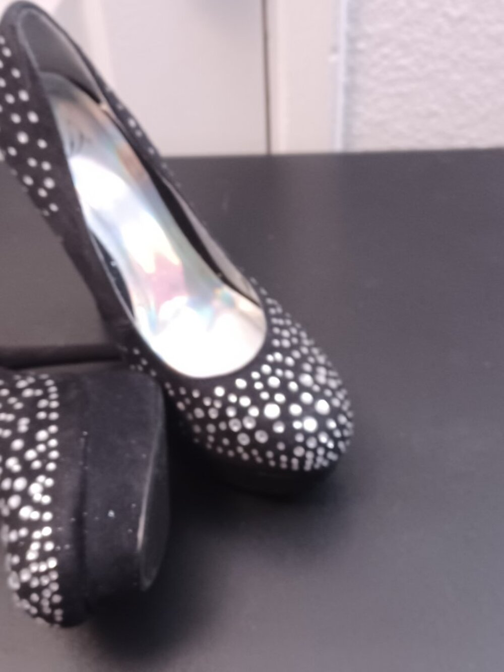 The Delicious brand offers a sleek and stylish black 5in heel designed for women